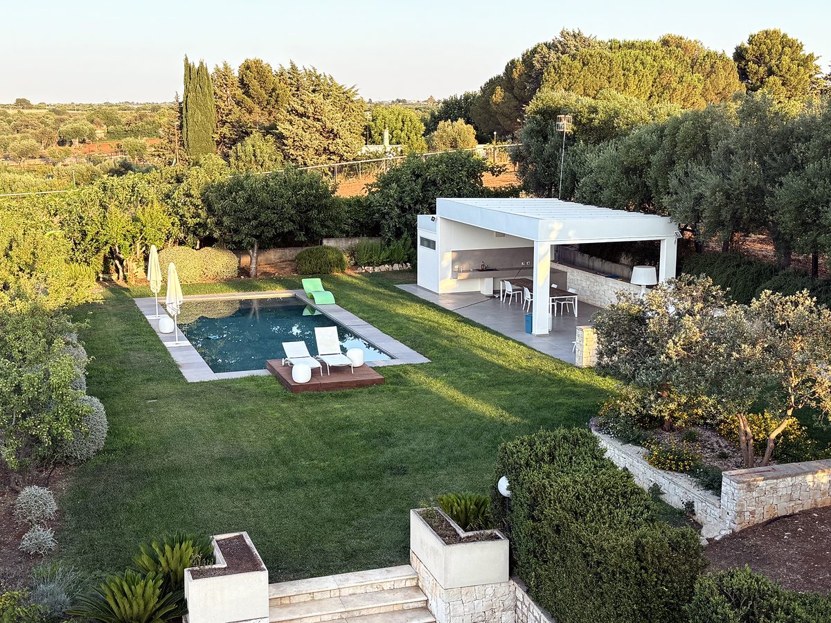 A house and pool in a Puglian olive grove