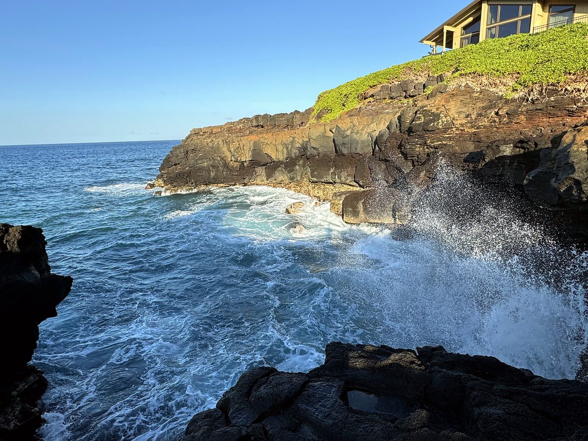Surf exploding against the cliffs