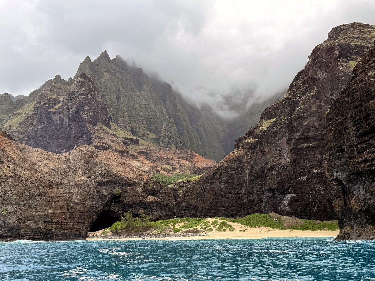 The Nā Pali coast rising from the sea