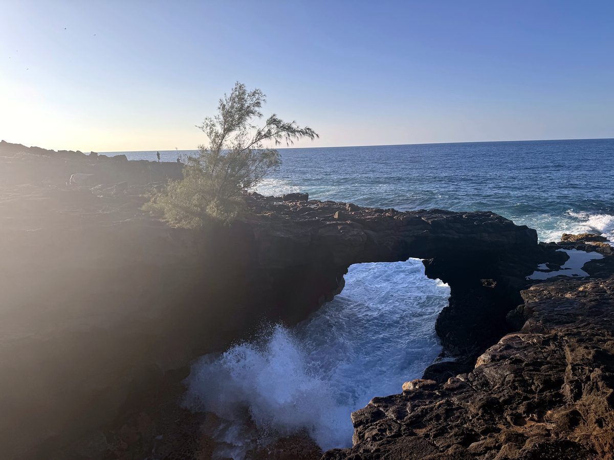 Surf spouting through the rocks on the south shore