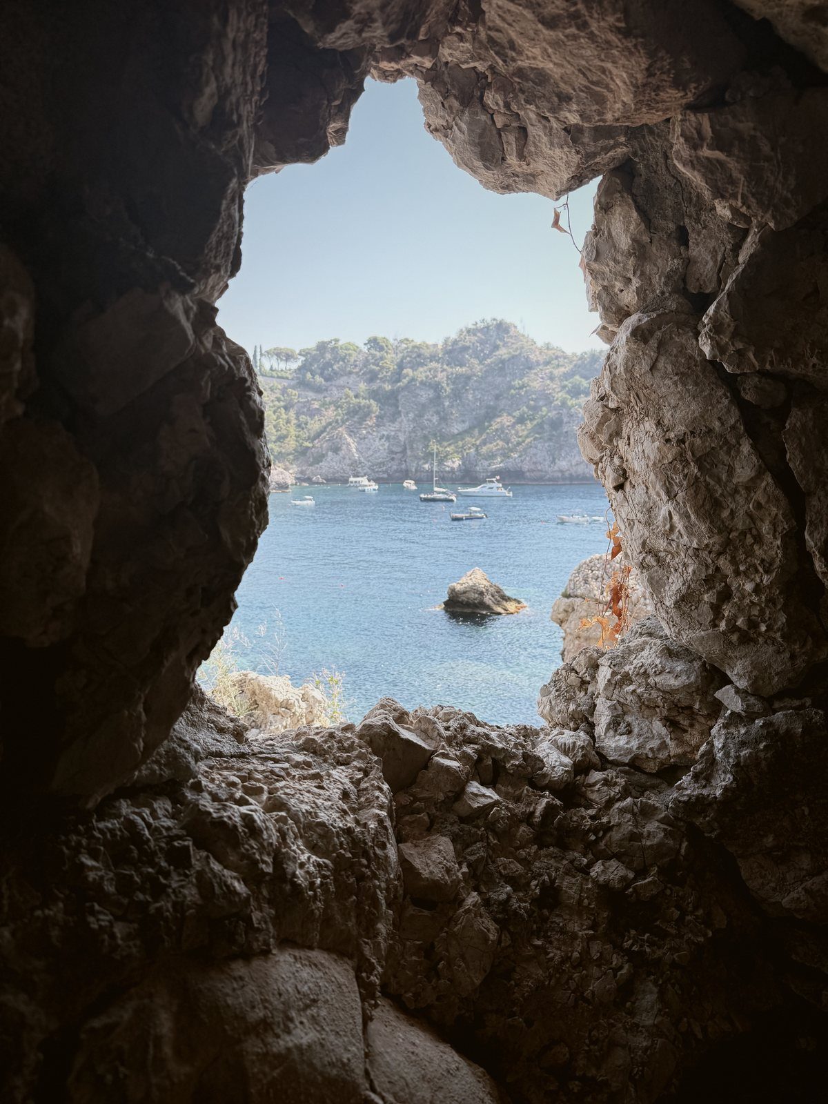 A rock arch over the sea, Taormina